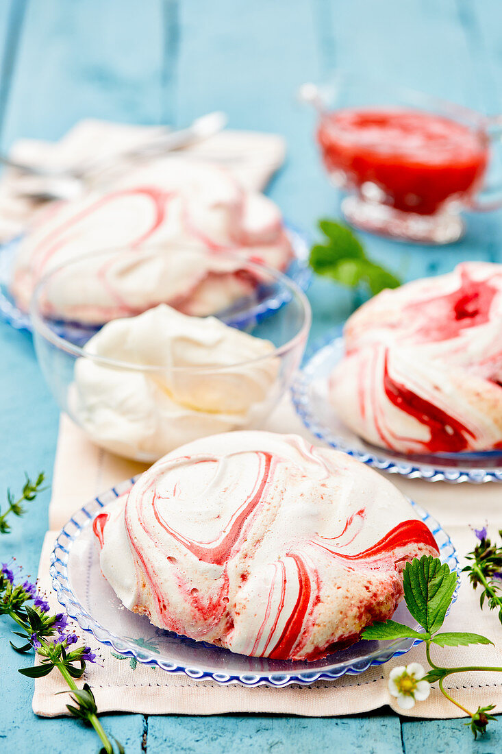 Meringues with strawberry swirls