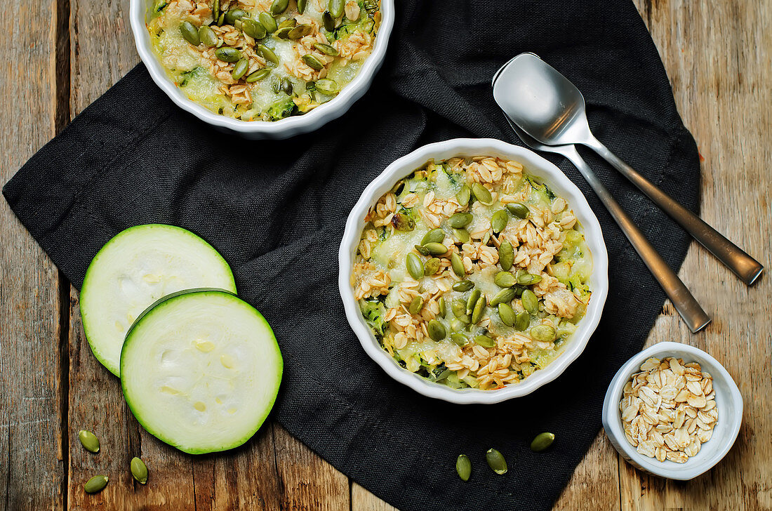 Zucchini with oatmeal, cheese and pumpkin seeds