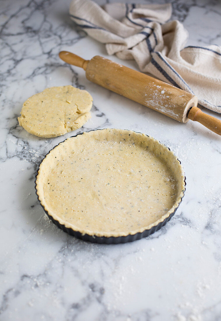 A tart base in a baking dish