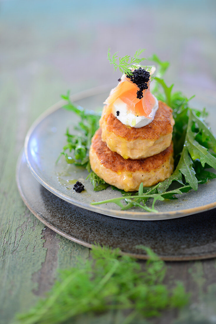 Salmon burger with rocket and dill sour cream