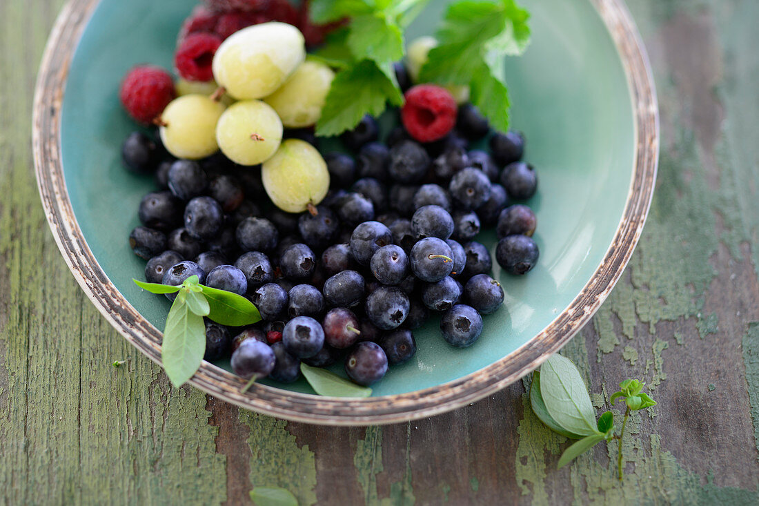 Colourful summer berries in a small bowl