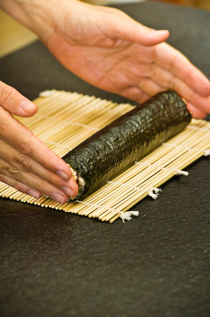 Vegan nori maki being rolled up