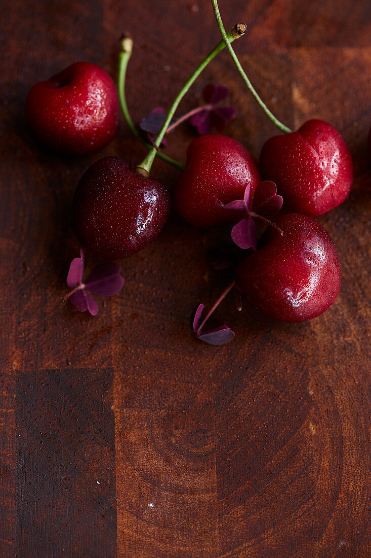 Fresh cherries on a wooden surface