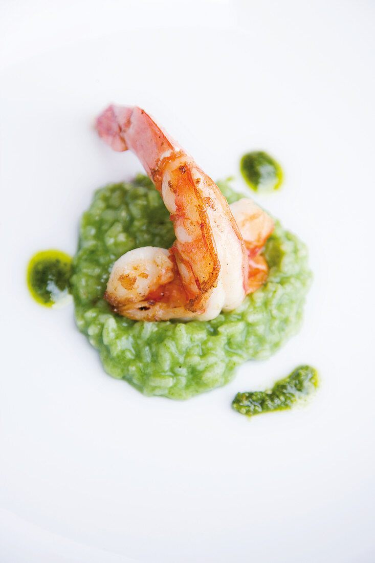 Fried giant prawns on wild garlic risotto