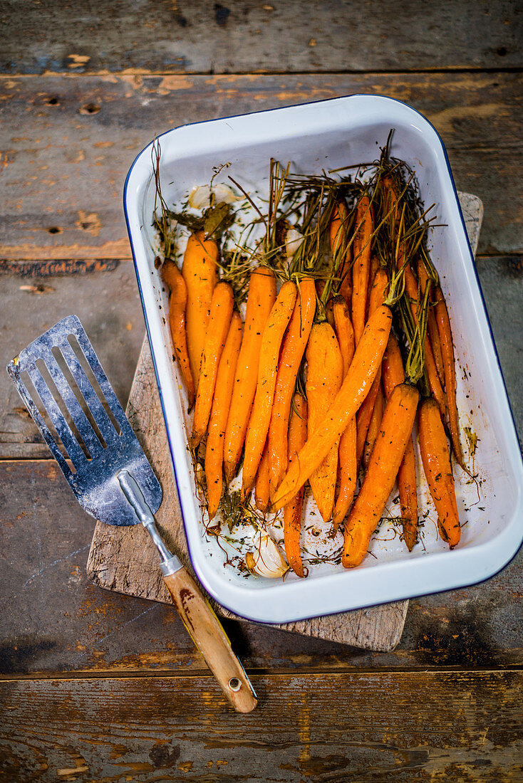 Oven roasted baby carrots in a dish