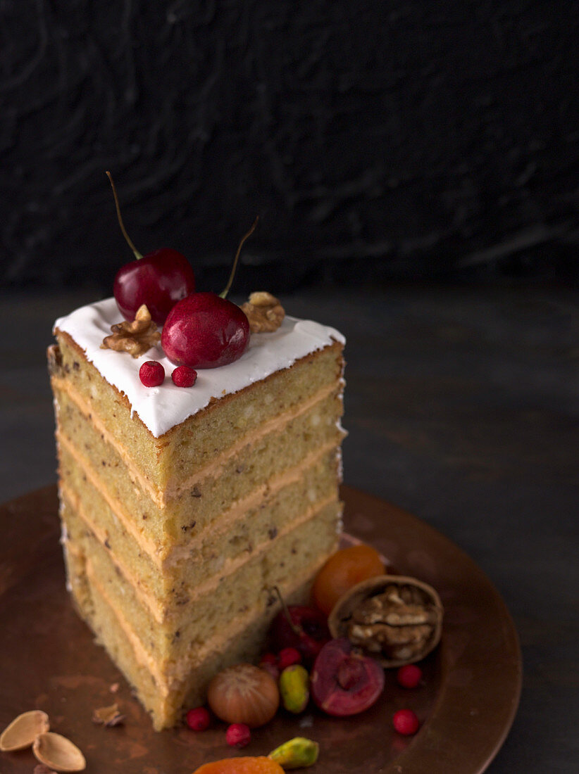 A slice of layer cake with a cream filling