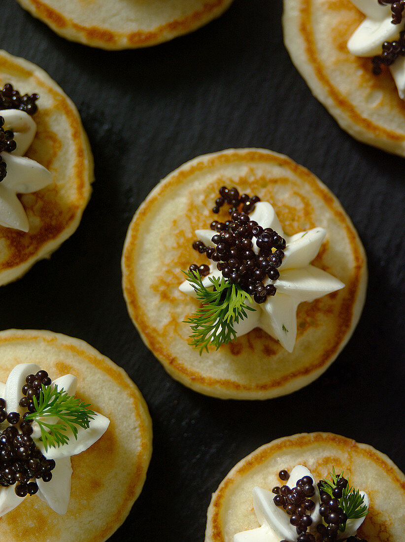 Blinis with caviar (seen from above, close-up)