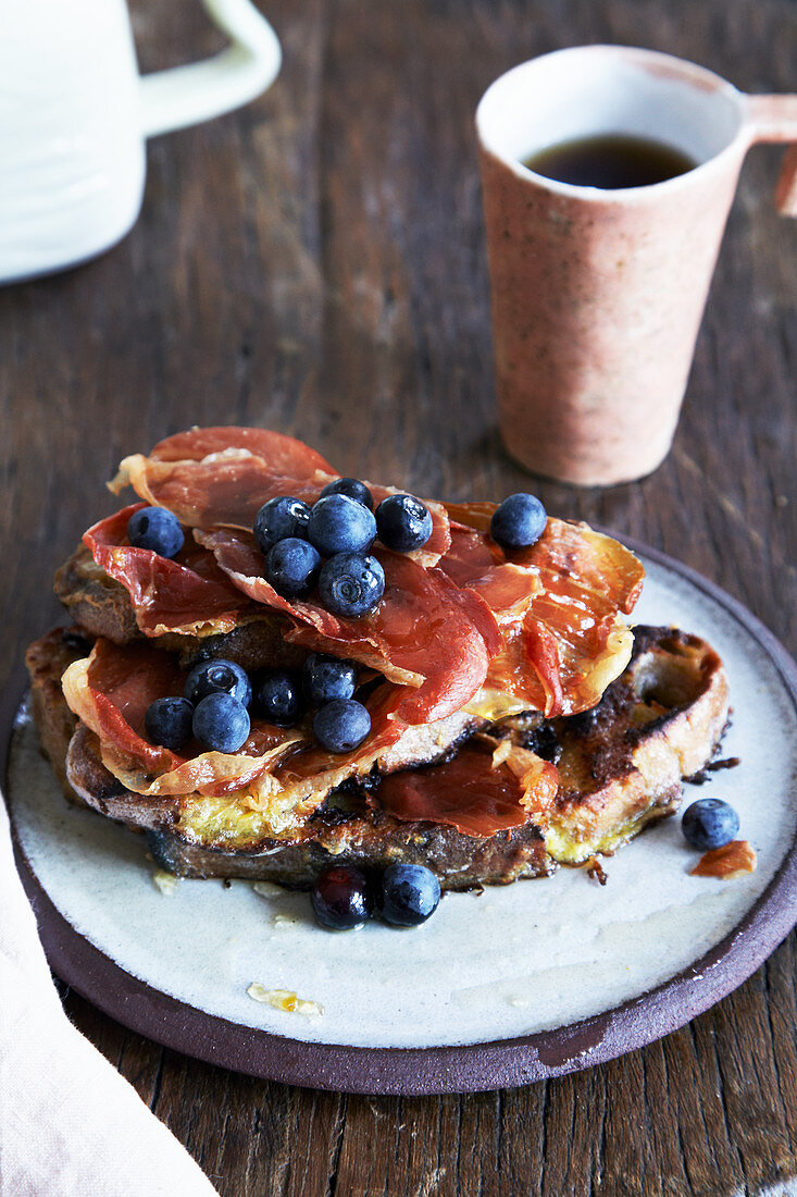 Toast with bacon, blueberries and maple syrup