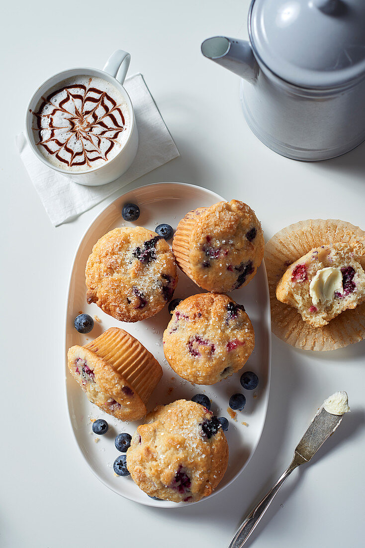 Berry muffins with coffee (seen from above)
