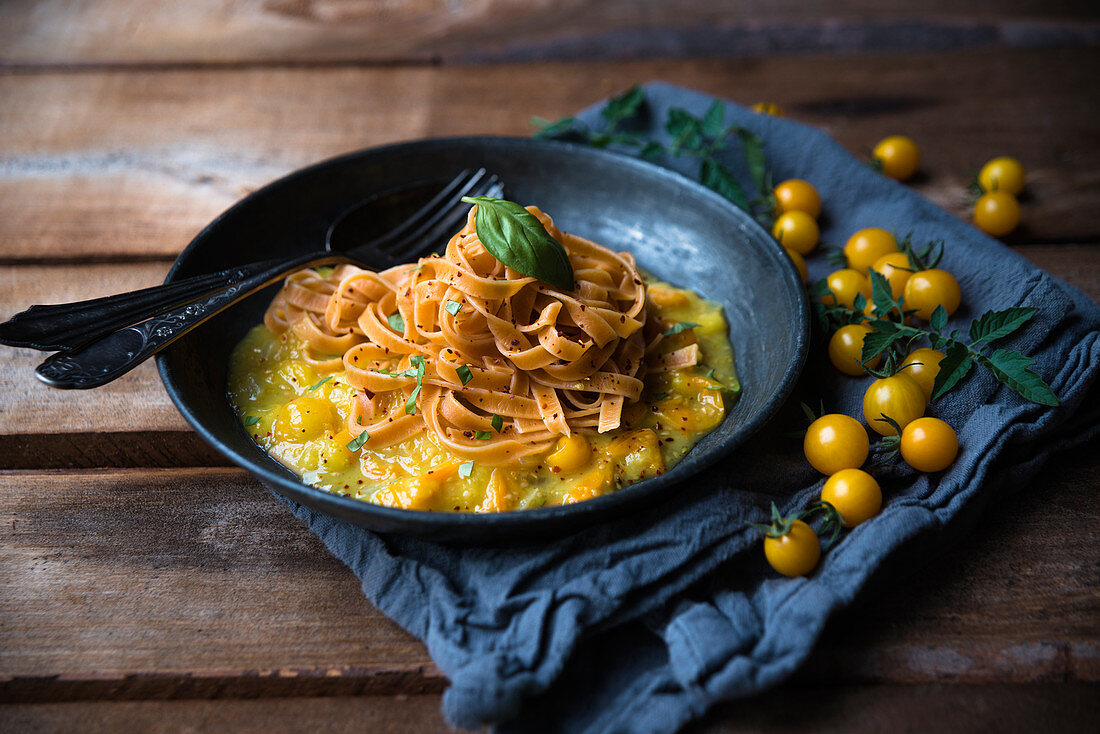 Tomato tagliatelle on yellow tomato sauce (vegan)