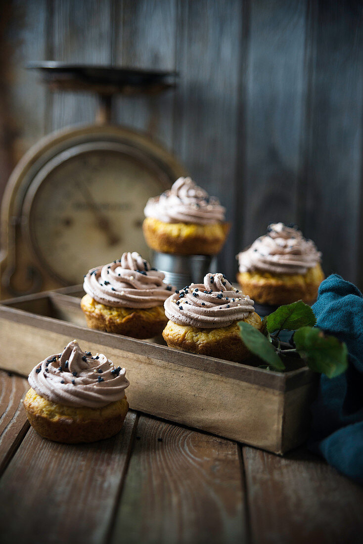 Vegan pumpkin cupcakes with chocolate cashew frosting and sugar decorations