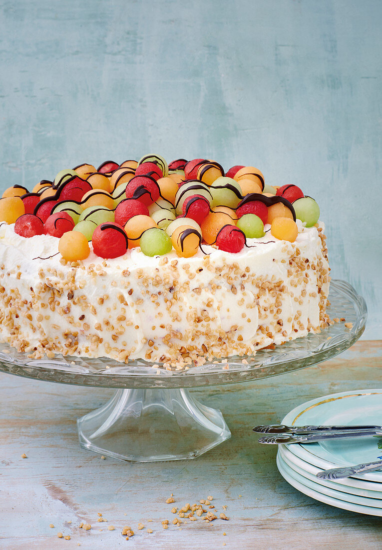 Colourful melon pie on a cake stand