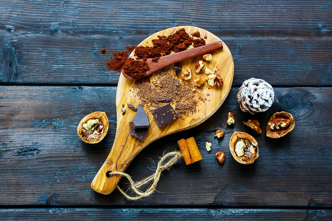 Ingredients for making rich winter hot chocolate with cinnamon sticks and walnuts