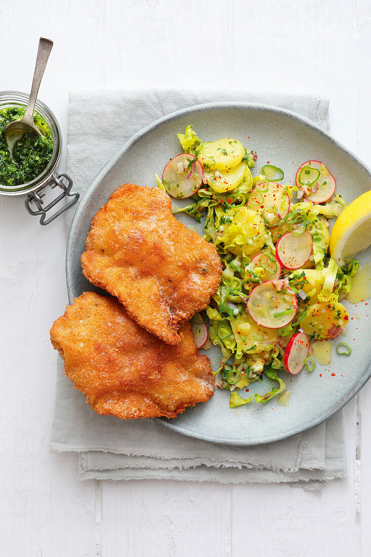 Wiener schnitzel (breaded veal escalopes) with potato and herb salad