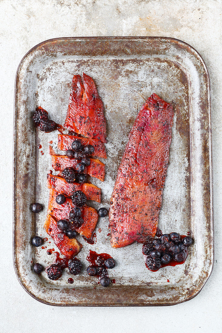 Marinated and smoked salmon trout fillets with berry chutney