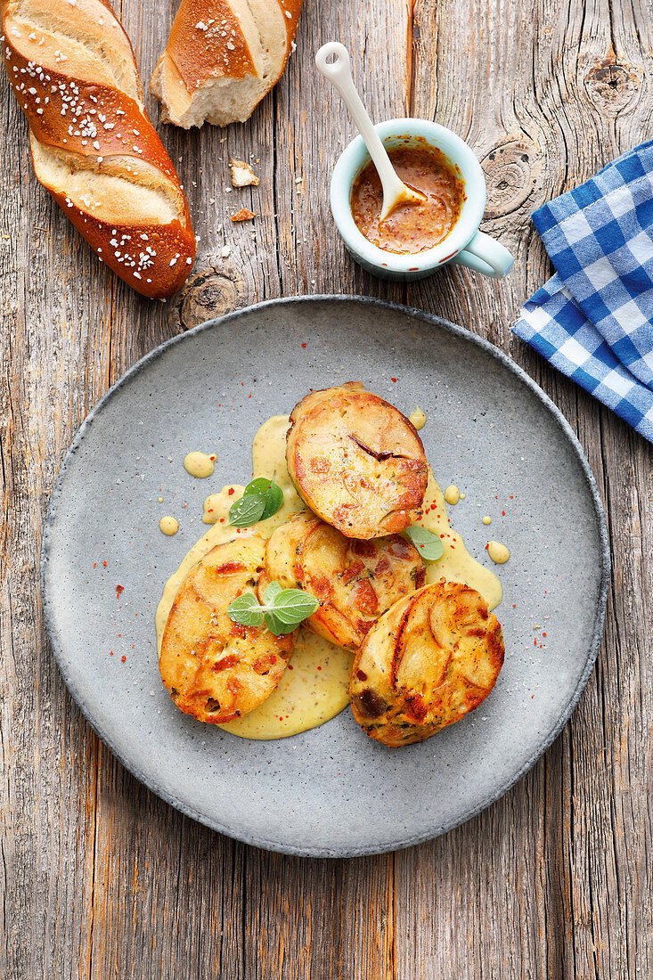 Pretzel and white sausage dumplings with mustard sauce