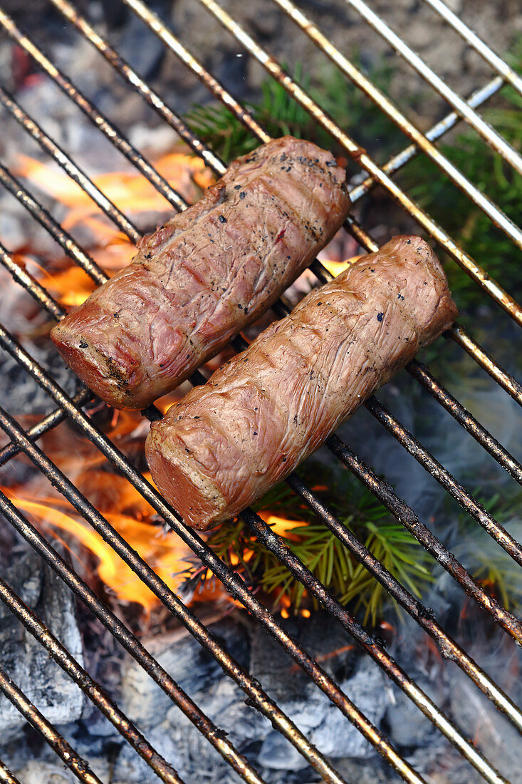 Grilled venison smoked on an open fire