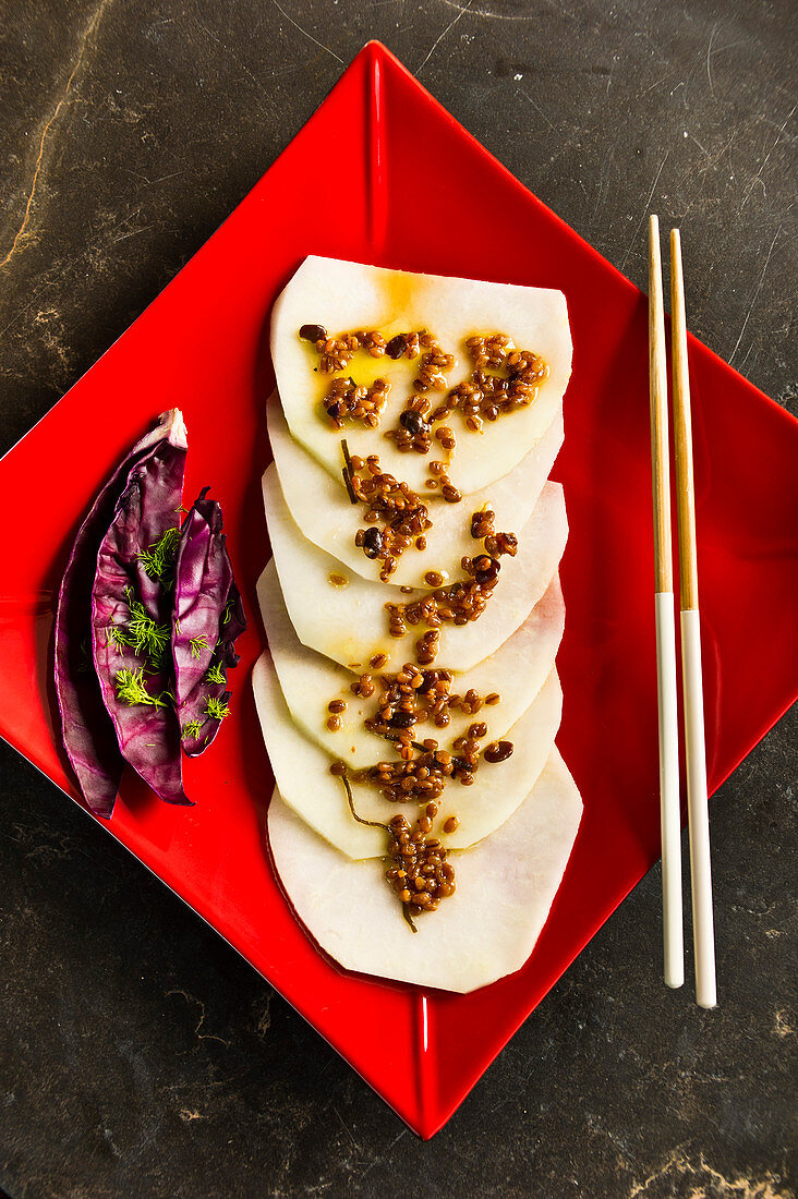 Kohlrabi carpaccio with natto miso dressing