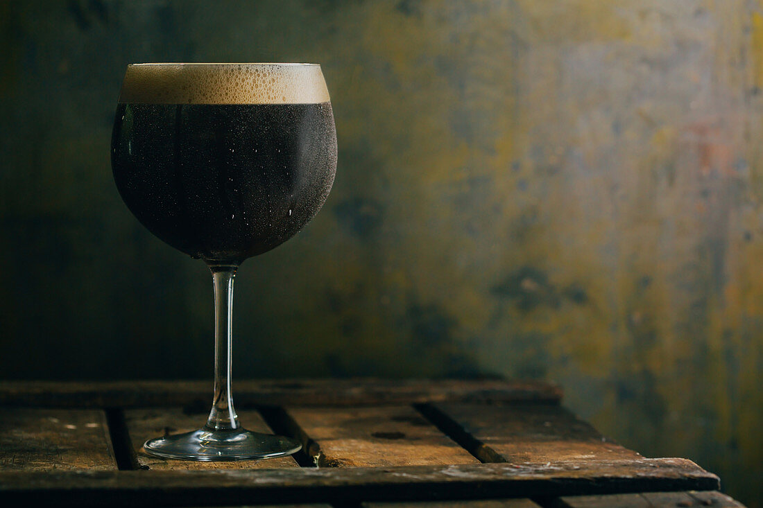 A glass of dark beer