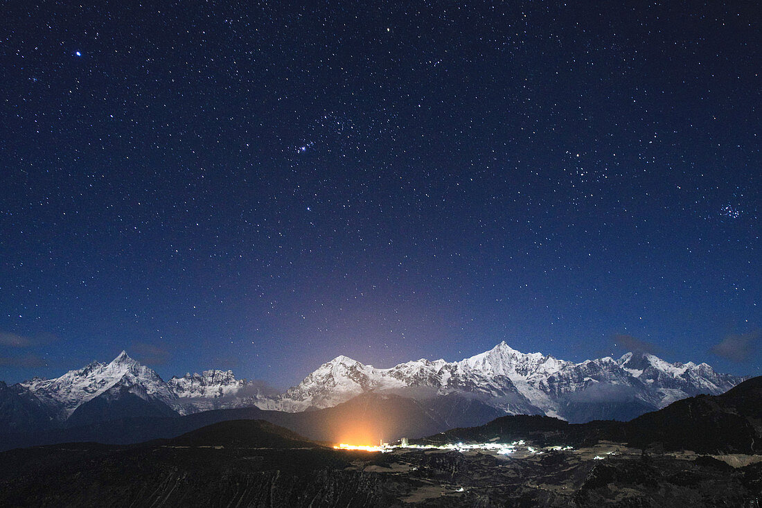Night sky over Meili Snow Mountains, China