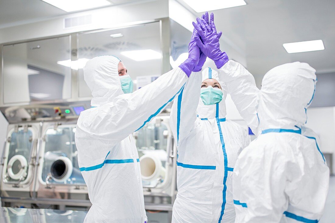 Lab technicians high-fiving