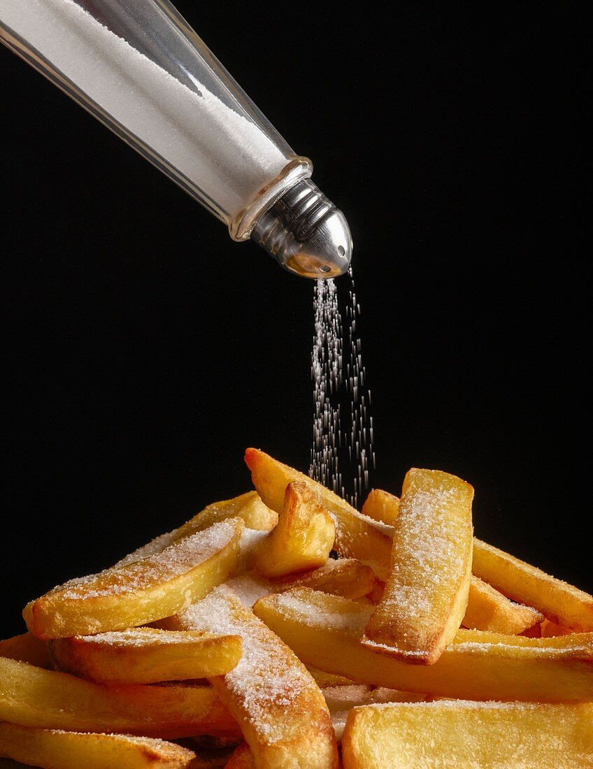 Salt pouring onto chips