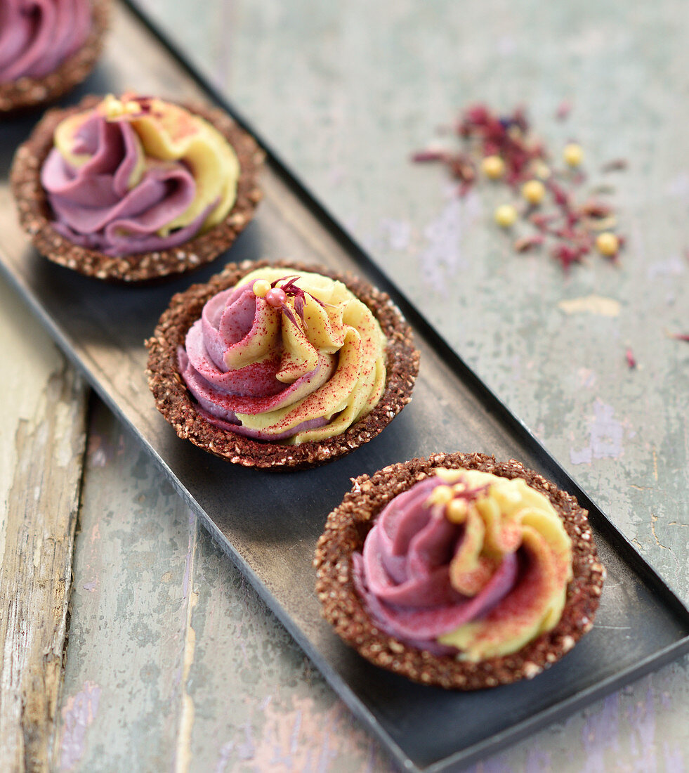 Raw vegan mini tartlets with colourful cream