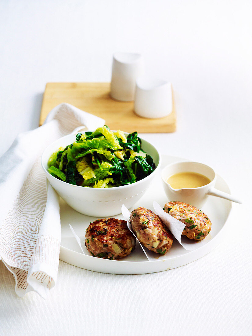 Pork rissoles with peppered greens
