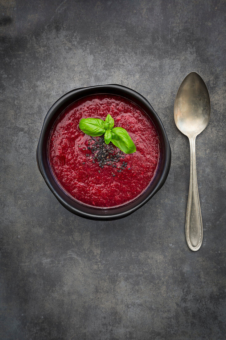 Beetroot soup with basil and black nuts