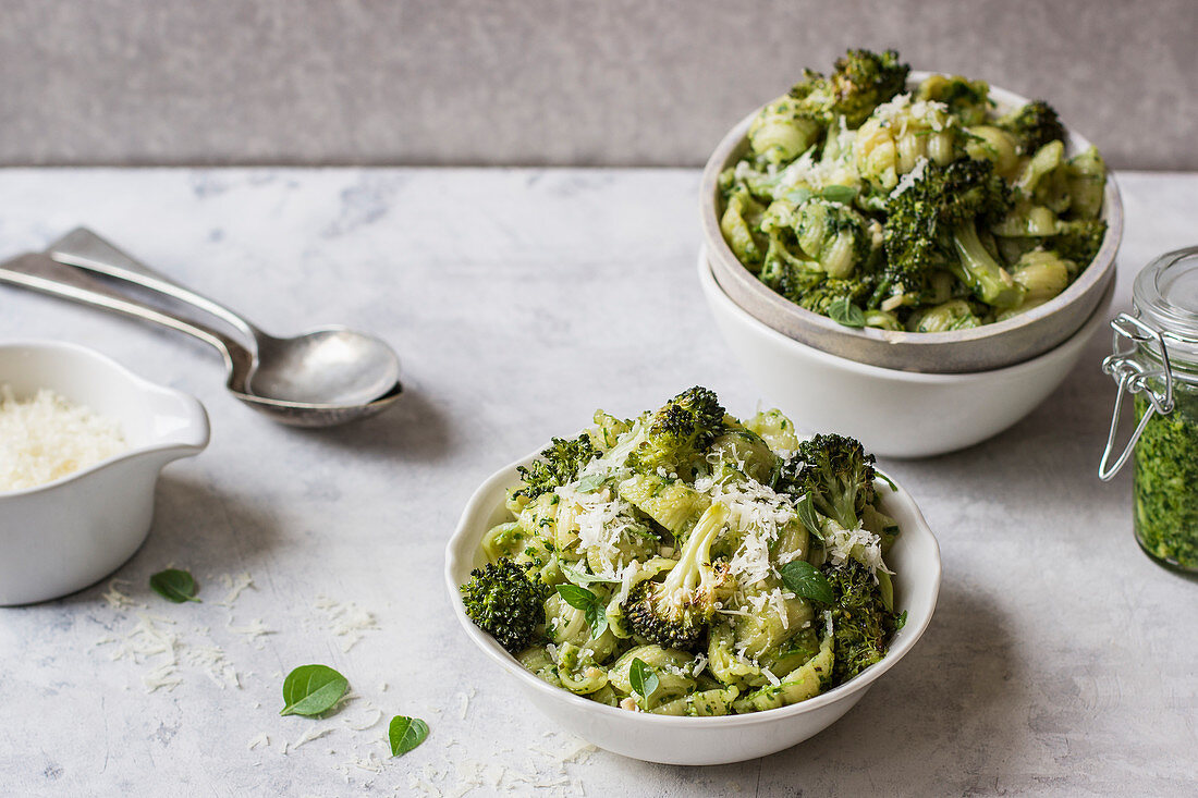 Pasta shells with basil pesto and roasted broccoli florets and grated parmesan