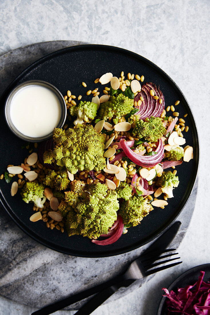 Roasted romanesco cauliflower salad with roasted red onions and ancient grains (roasted farro)