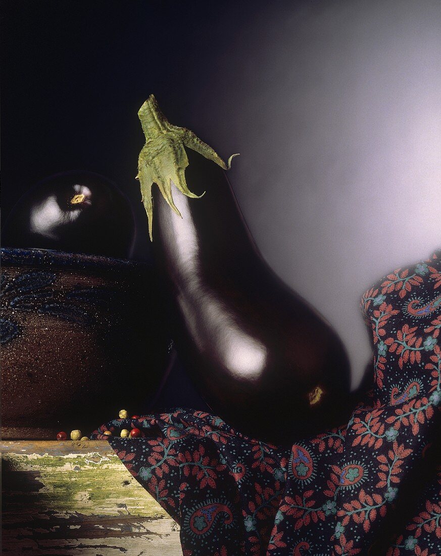 Eggplant on a Cloth on a Wooden Table