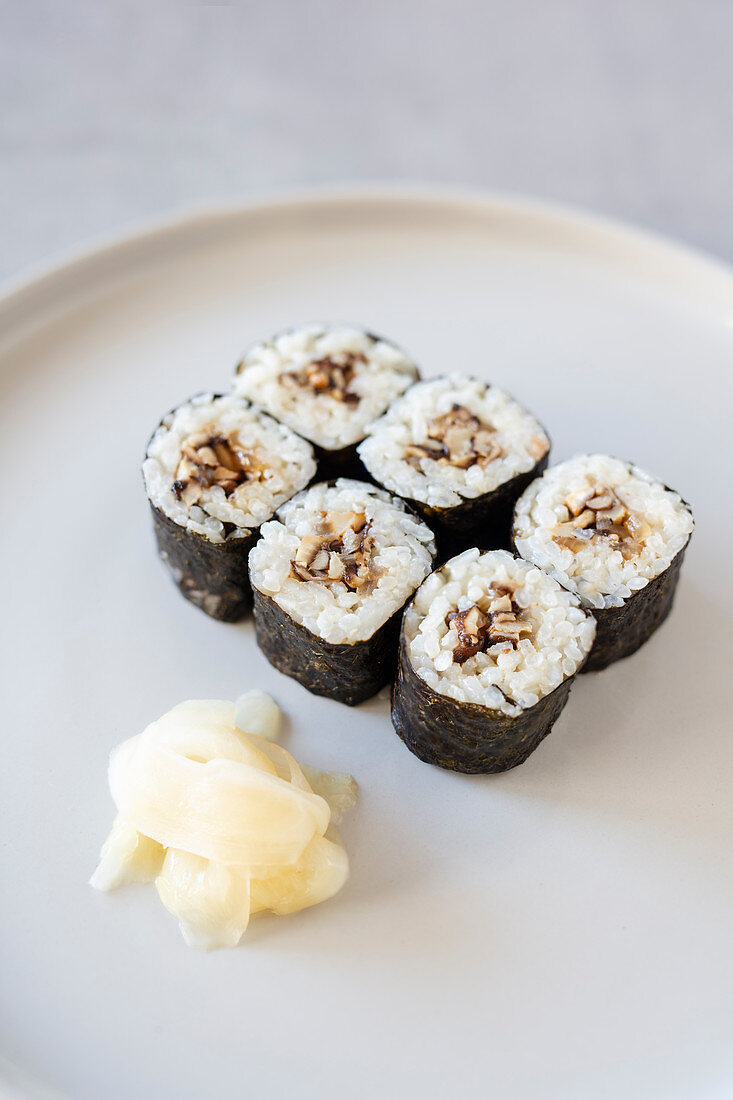 Vegan maki sushi with shiitake mushrooms and pickled ginger