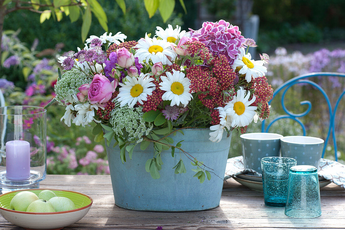 Bouquet of daisies, yarrow, roses and cartilage