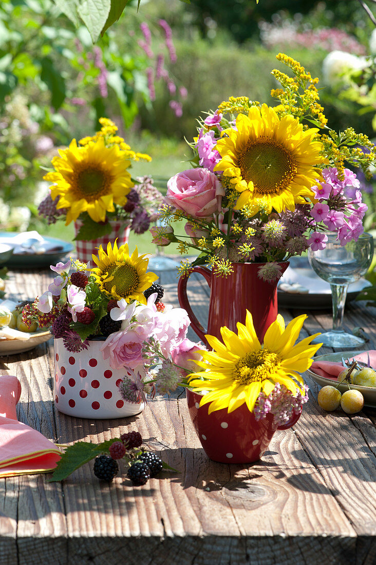 Bouquets of sunflowers, roses and perennials