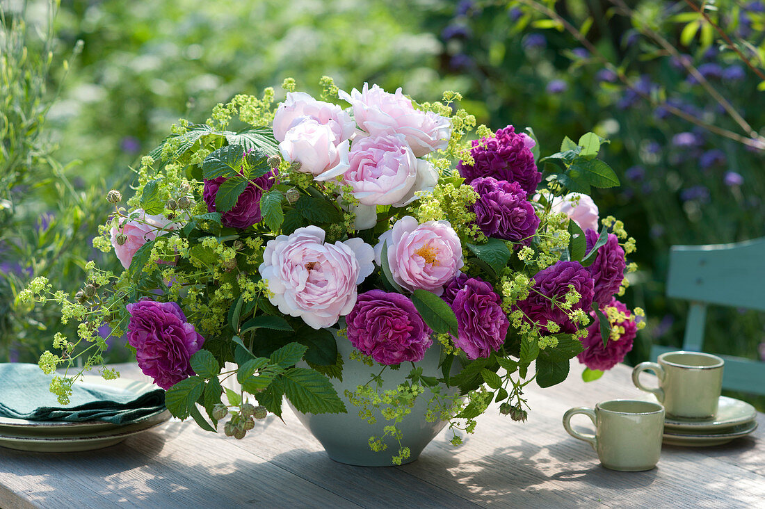 Lush arrangement with roses 'Charles de Mills' 'Scepter d'Isle' and lady's mantle