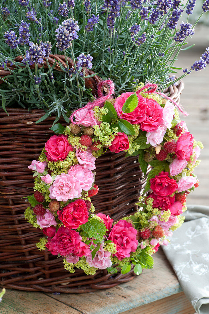 Wreath of rose petals, lady's mantle and raspberries