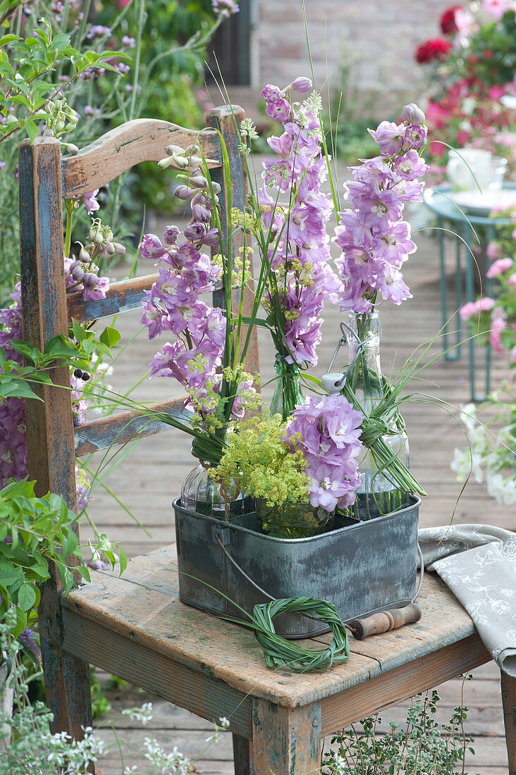 Flowers of delphinium in bottles