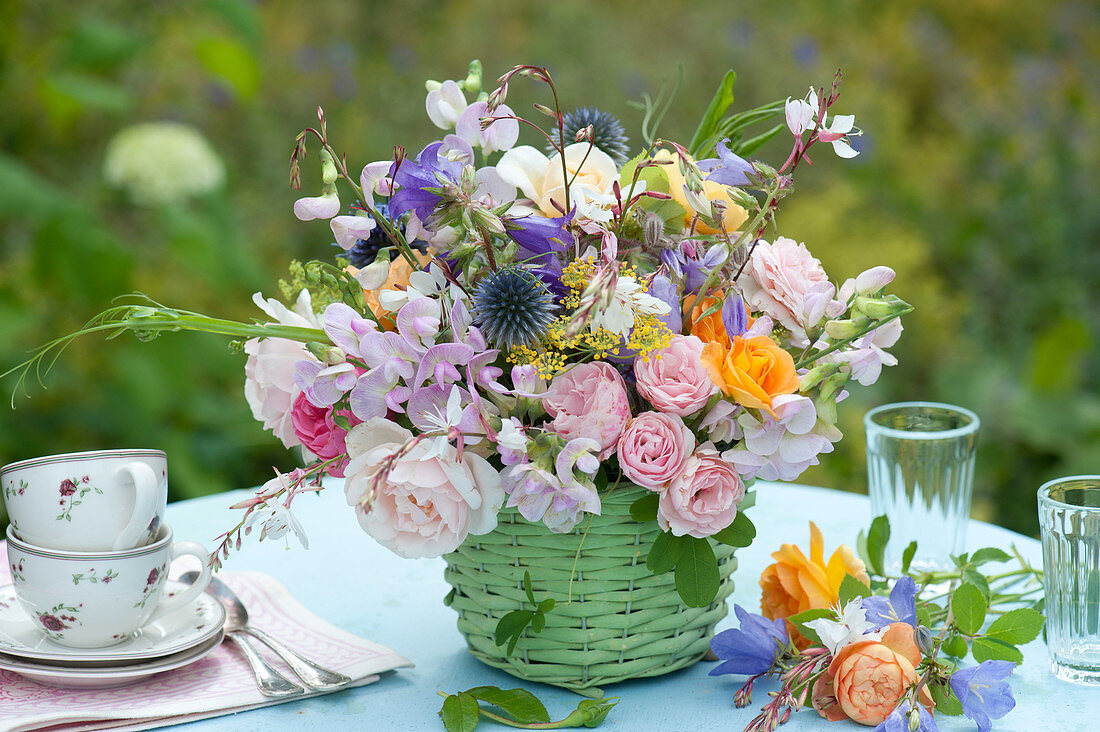 Bouquet of roses, sweet peas, ball thistle, bluebells and fennel