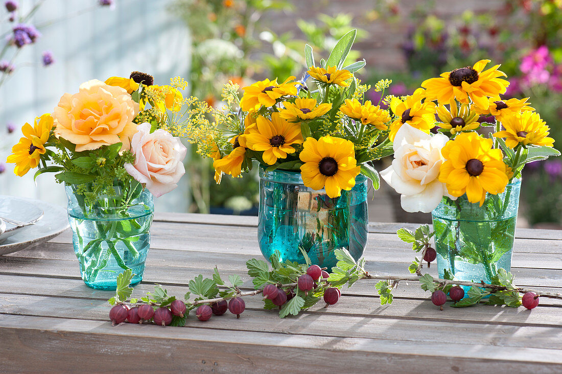 Small bouquets with coneflowers, roses, fennel and sage