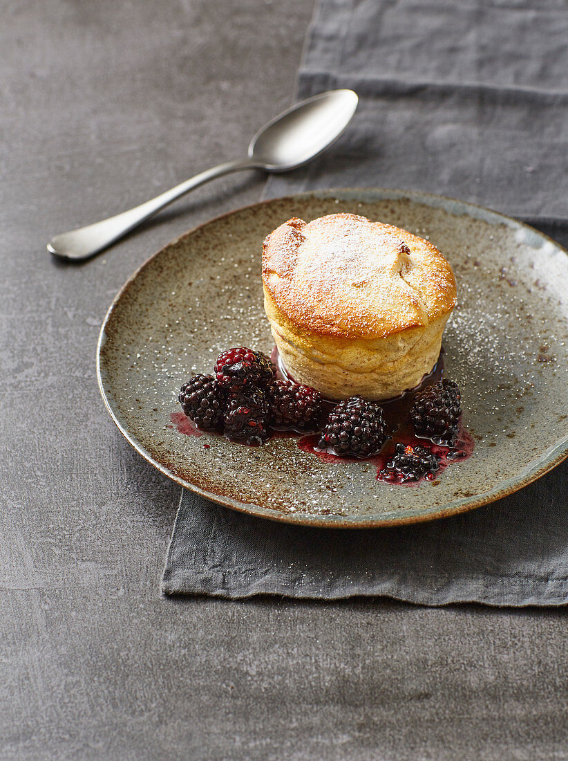 Almond-quark souffle with flambéed blackberries