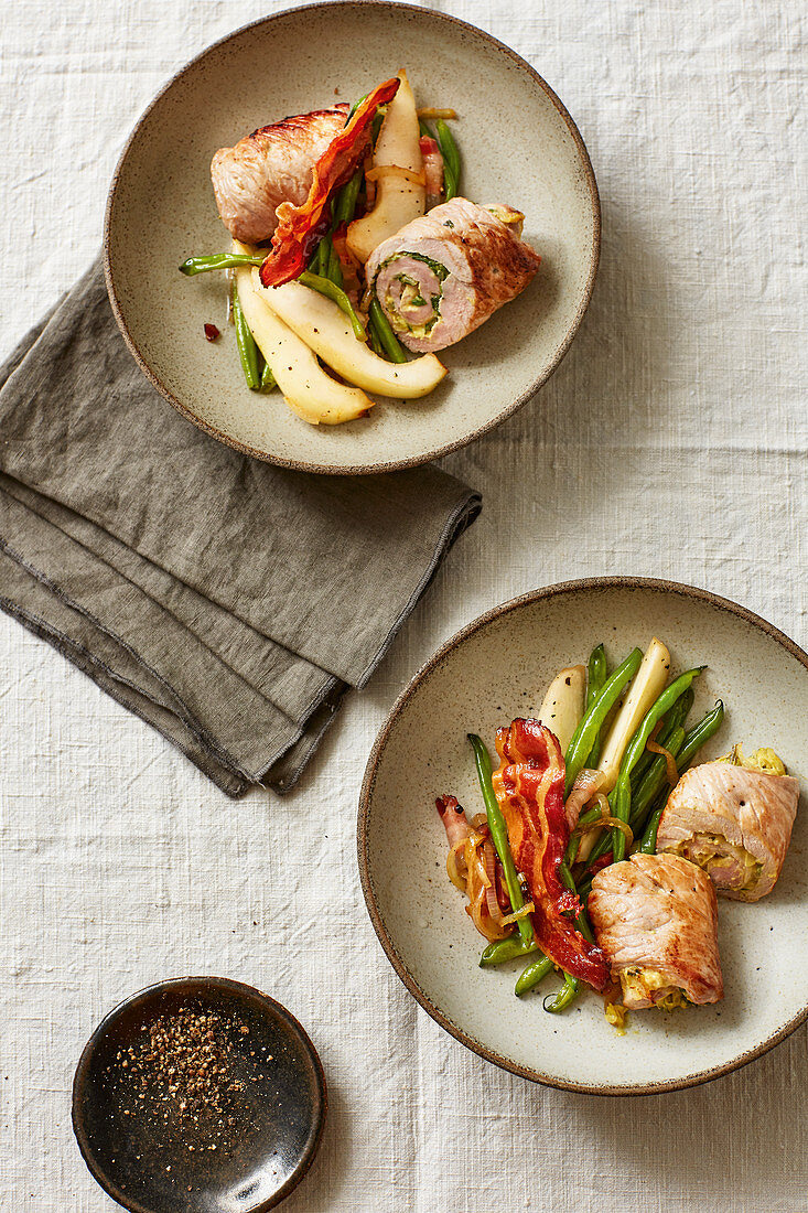 Pork roulade with a pear, bean and bacon salad