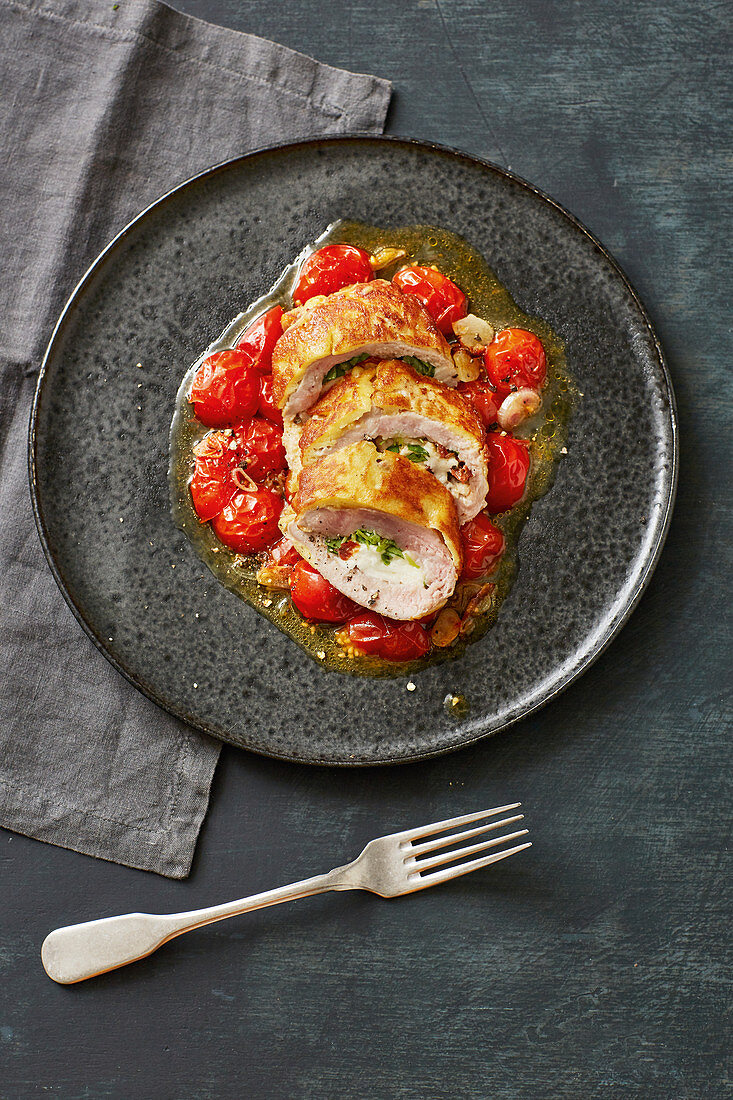 Stuffed piccata with warm oven-roasted tomatoes