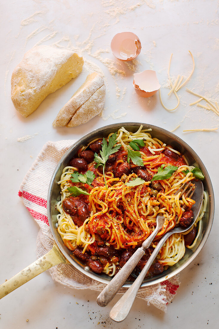 Spaghetti puttanesca with kalamata olives and anchovies (Italy)