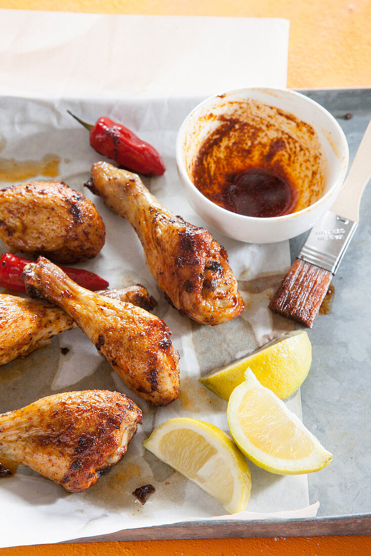 Marinated drumsticks on baking paper