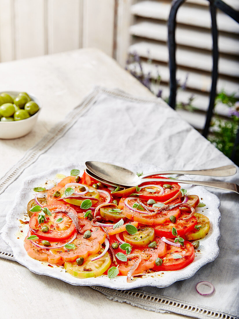 Tomato and Onion Salad With Capers Served with Olives