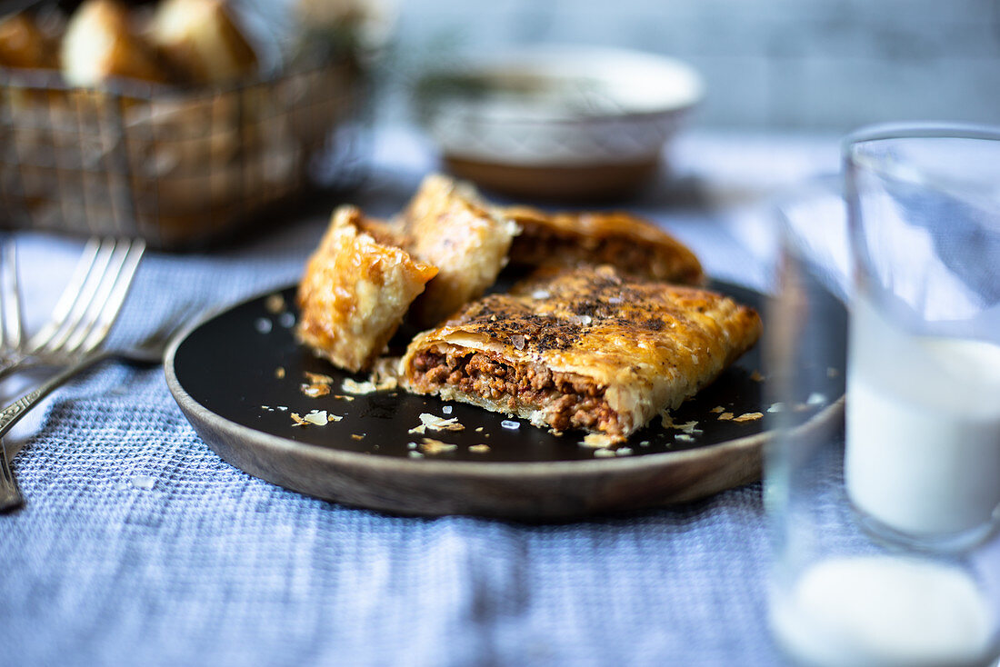 Minced meat puff pastry served with yoghurt