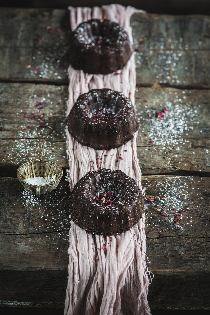 Chocolate mini bundt cakes with a dusting of powder