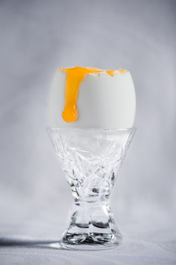 A single duck egg in a cyrstal egg cup