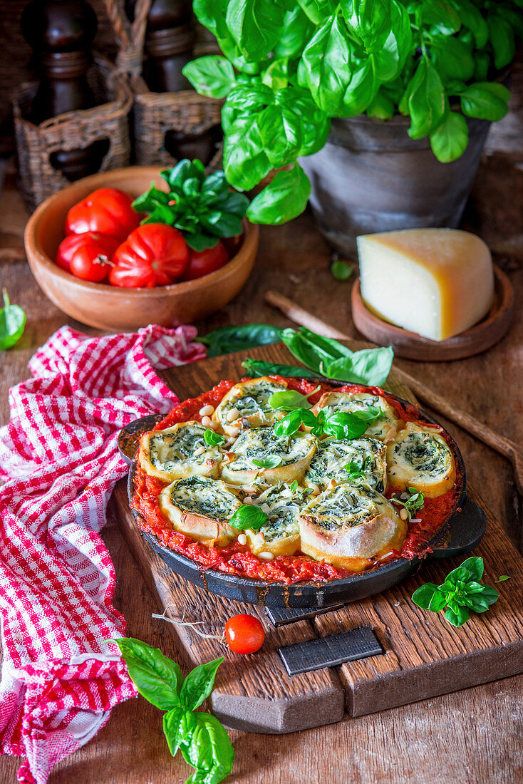 Spinach rotolo baked in tomato sause